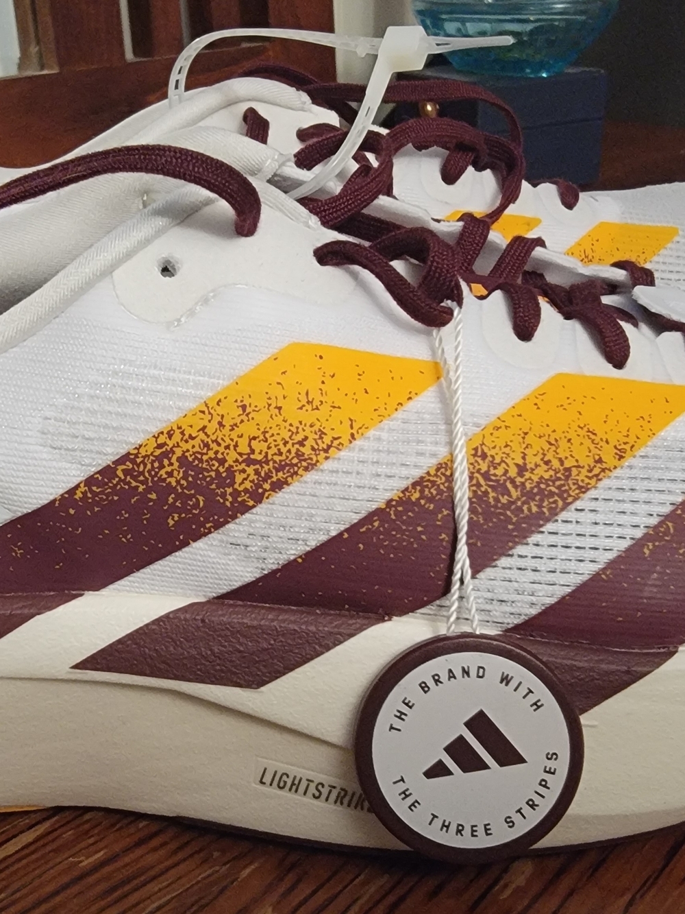 Adidas Adizero Evo SL Sneakers in White & Burgundy Arizona Sun Devils